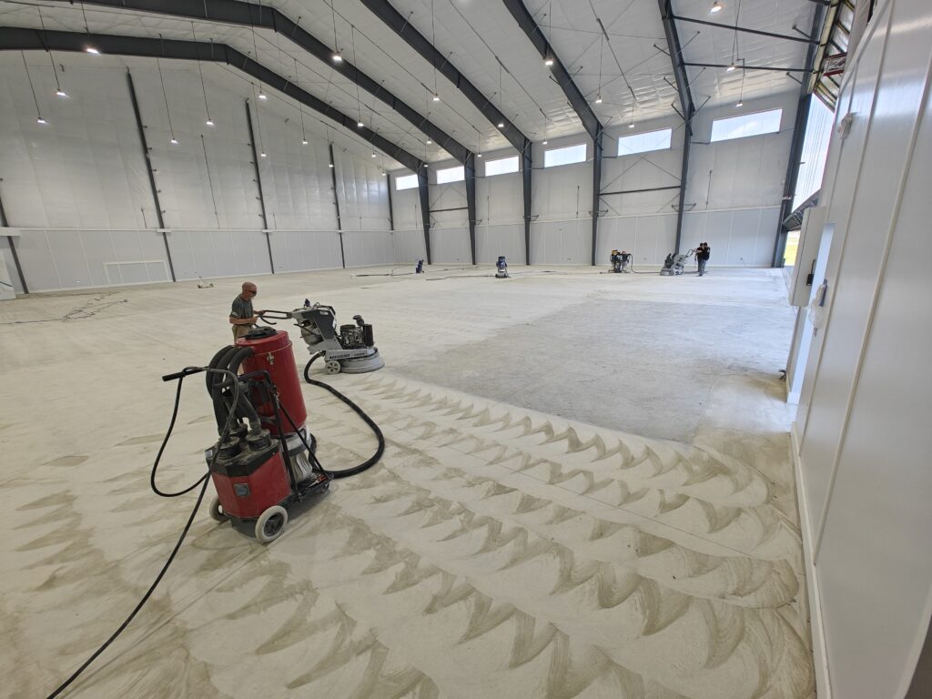 Airplane-Hangar-Concrete-Coatings-15000-sq-ft-of-white-epoxy-with-aliphatic-urethane-top-coat-Fluker-LA-scaled