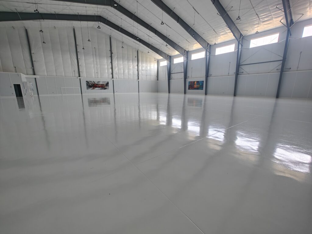 Airplane-Hangar-Concrete-Coatings-15000-sq-ft-of-white-epoxy-with-aliphatic-urethane-top-coat-Hammond-LA-scaled